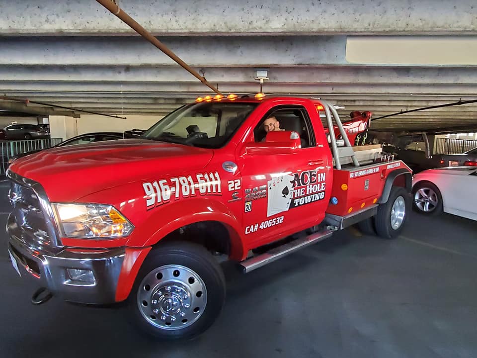 Our red tow truck is the perfect solution when a customer is in a low clearance parking garage and needs assistance. The Daily Parking Lot at the Sacramento International Airport (SMF) can be a problem for standard tow trucks, but our super star red tow truck can handle the job with ease.